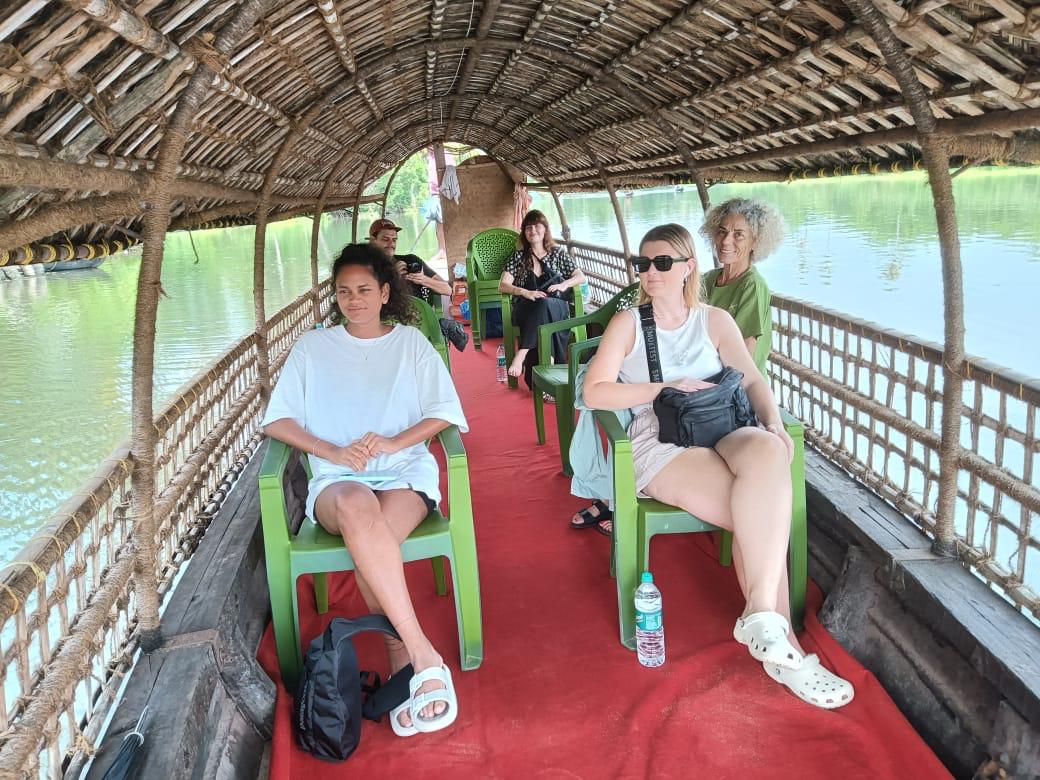 Guests enjoying the covered village boat.