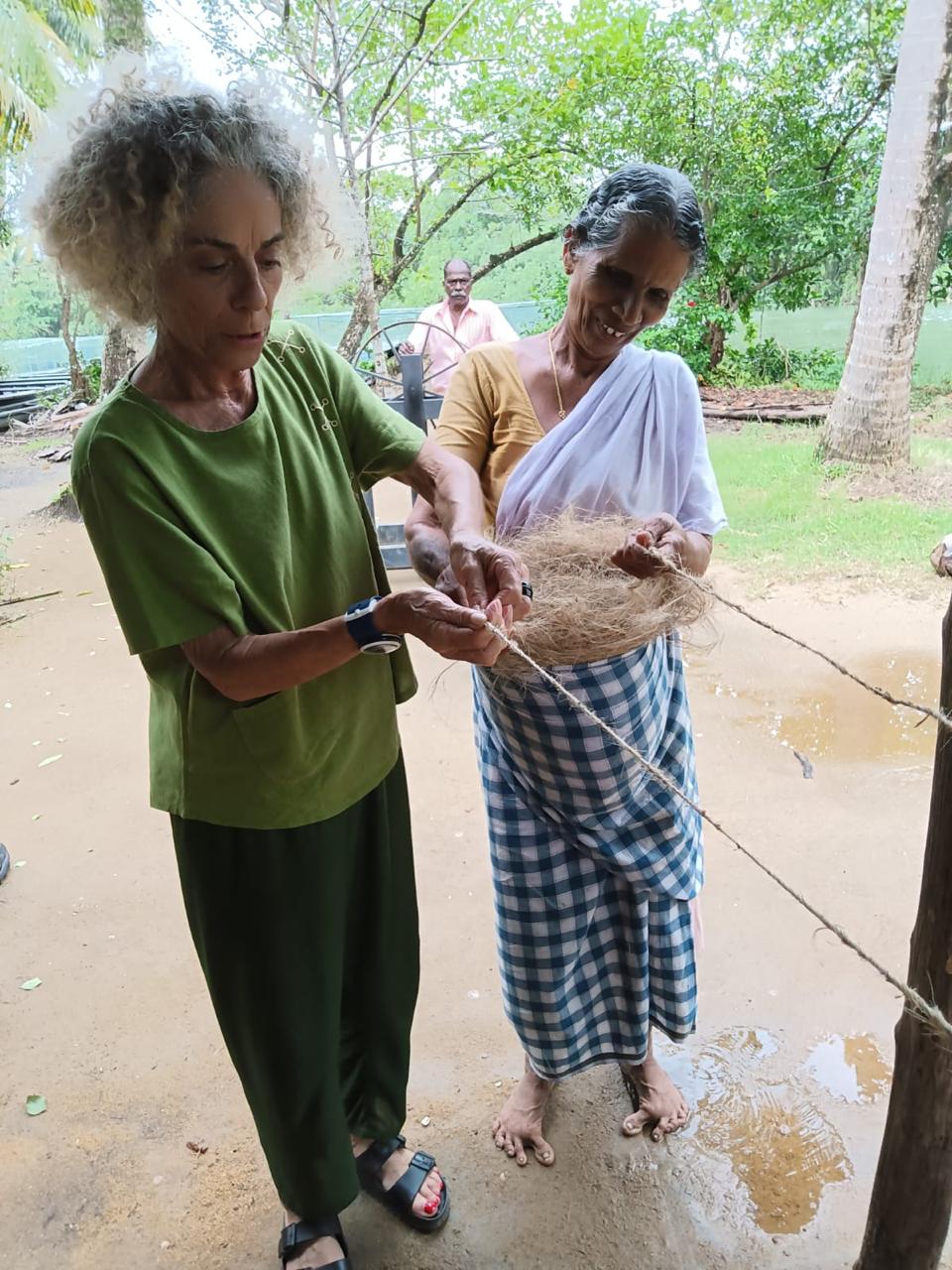 Visitors taking part in a village craft activity.